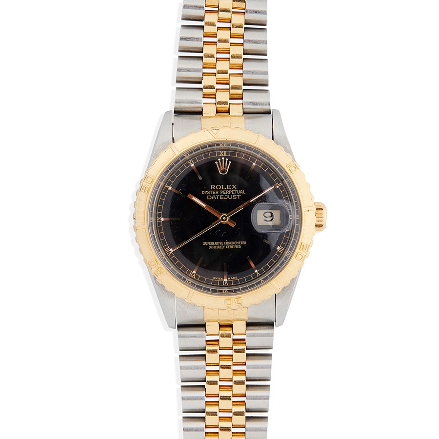 LOT 234 | ROLEX: A RARE STEEL WATCH Oyster Perpetual Datejust model 16253 Turn-O-Graph 'Thunderbird,' 1986 from serial number, stainless steel case with automatic movement, round black dial with gold baton hour markers with lume plots below the outer edge, date aperture at 3, gold tapered lume hands, gold centre seconds hand, railroad outer seconds track in gold with Roman numerals, textured gold bezel with count up scale, screw-down gold crown with coronet, on a stainless steel and gold President bracelet with 455B to the end links, signed Rolex foldover clasp with micro-adjustment facility, with R8, 62523 H 18 to the interior, in box, with outer box, with papers and booklets, with service card dated 2011 | Case: 36mm excluding crown and bezel | £2,000 - £3,000 + fees